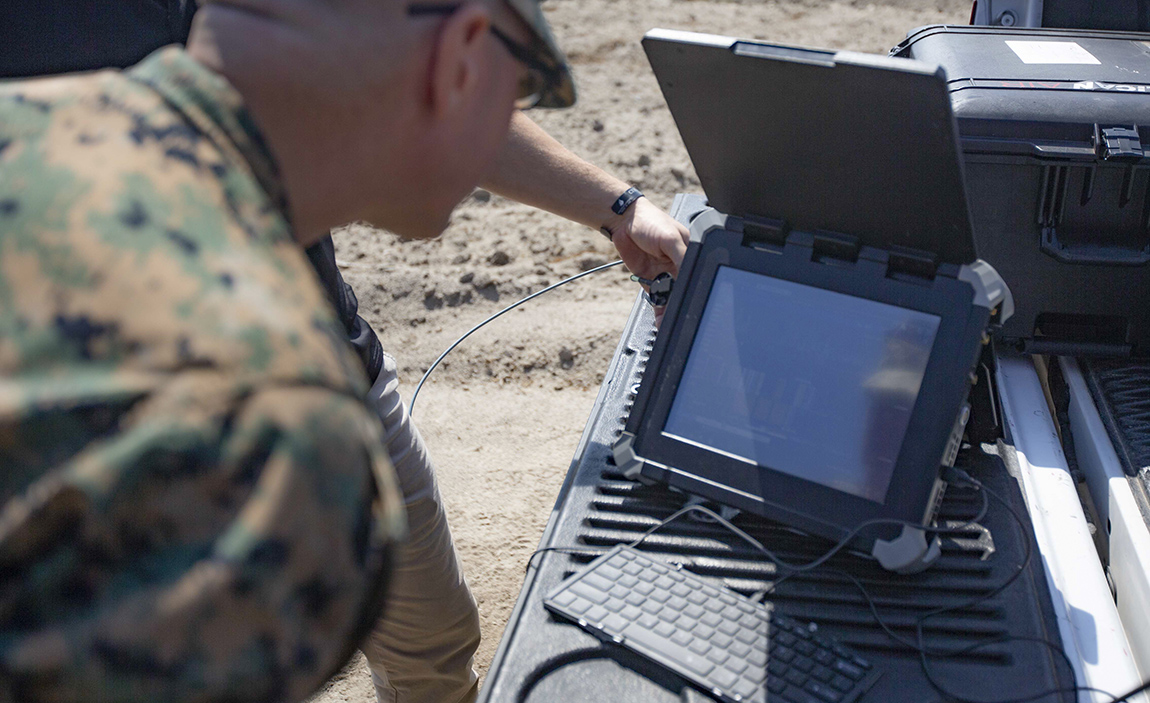 An electronic warfare chief analyzes information on the Spectrum Guard Elite system.