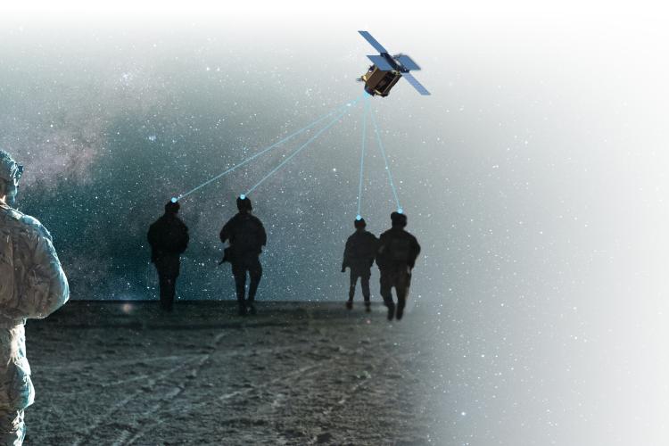 Soldiers walking at night with a satellite signal conection