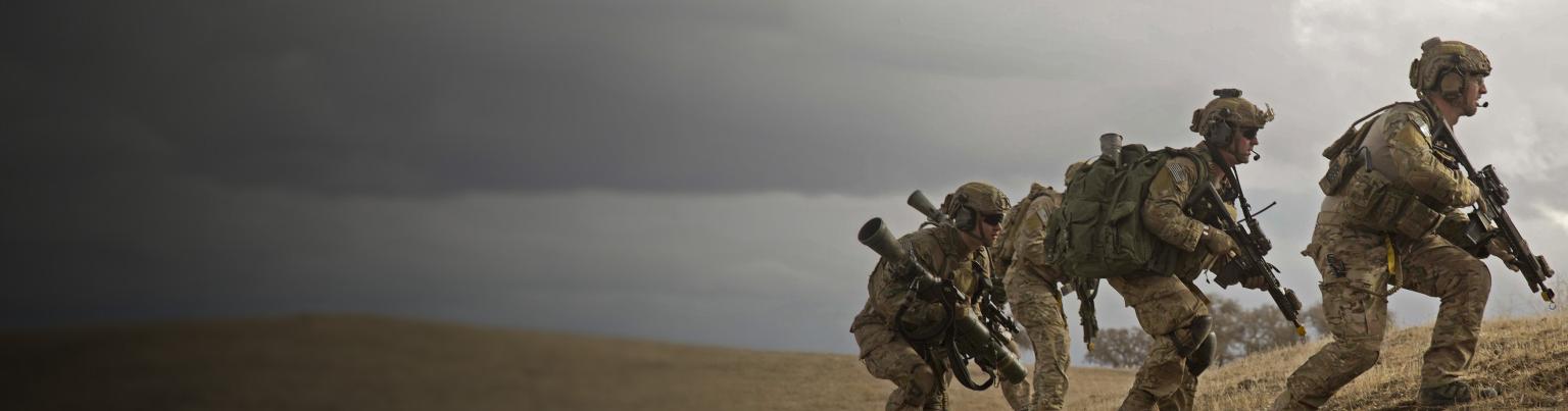 U.S. Army Rangers climb into position on a hillside during a training exercise.