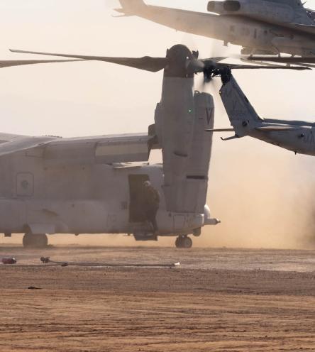 A group of soldiers loading into a helicopter